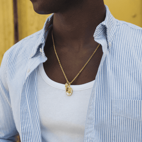 nike pendant gold styled